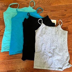 Lot of 4. Girls large tank tops.